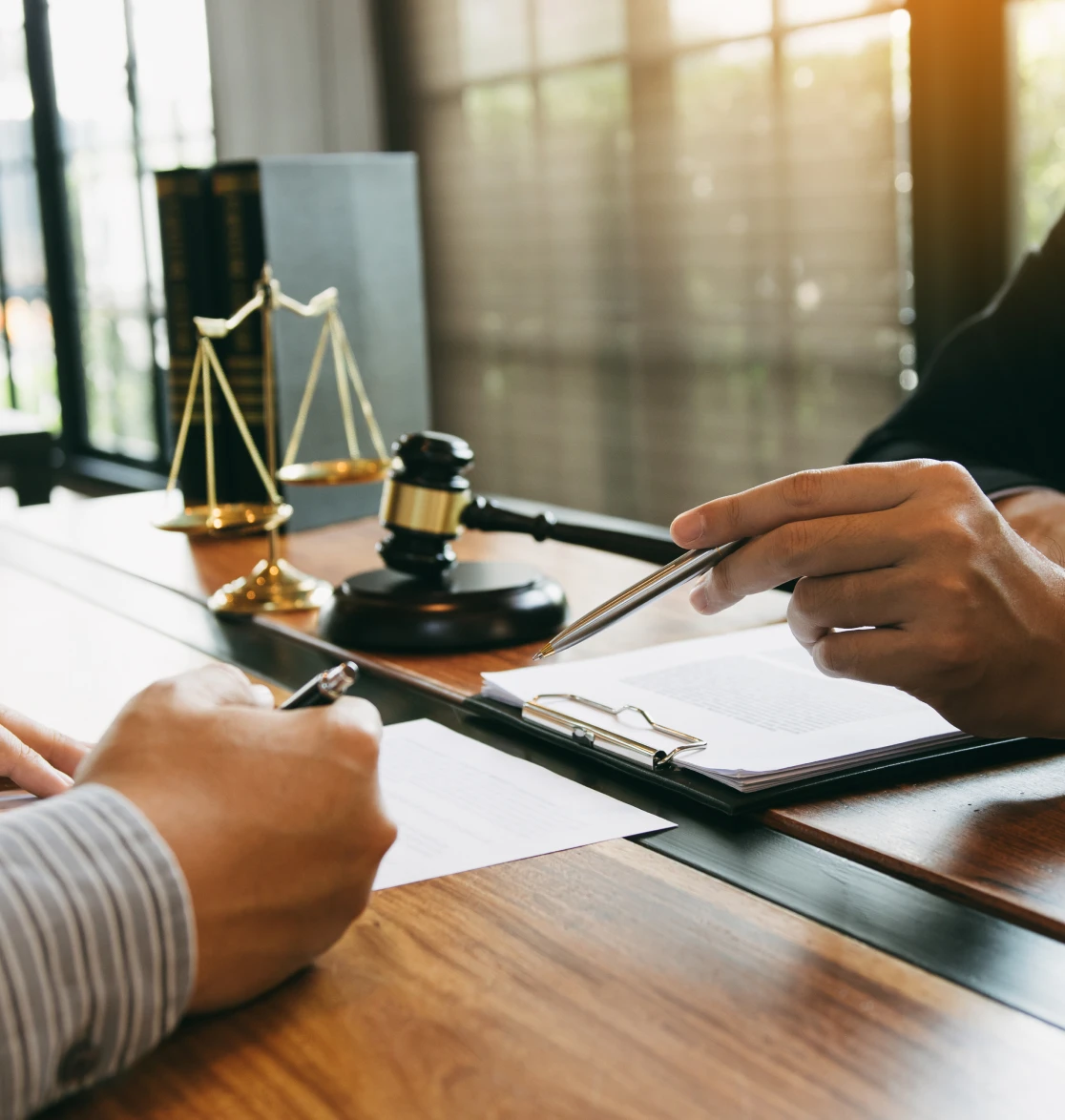 Legal discussion with documents and gavel
